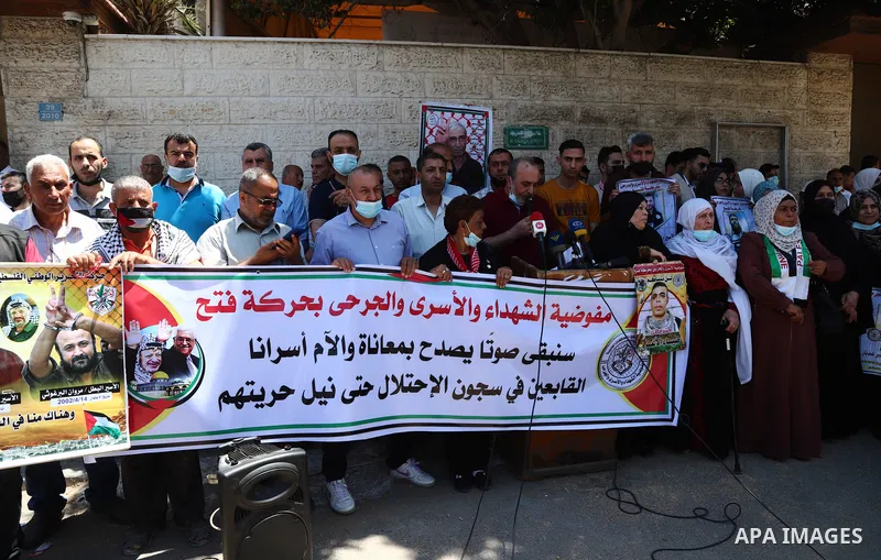 Palestinians take part in a protest to show solidarity with prisoners on Israeli Jails, in front of the headquarters of Red cross, in Gaza City on June 7, 2021. Some 4,650 Palestinian prisoners were being held in the Isr...