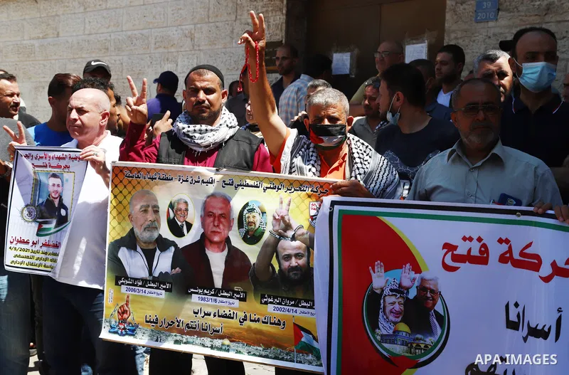 Palestinians take part in a protest to show solidarity with prisoners on Israeli Jails, in front of the headquarters of Red cross, in Gaza City on June 7, 2021. Some 4,650 Palestinian prisoners were being held in the Isr...