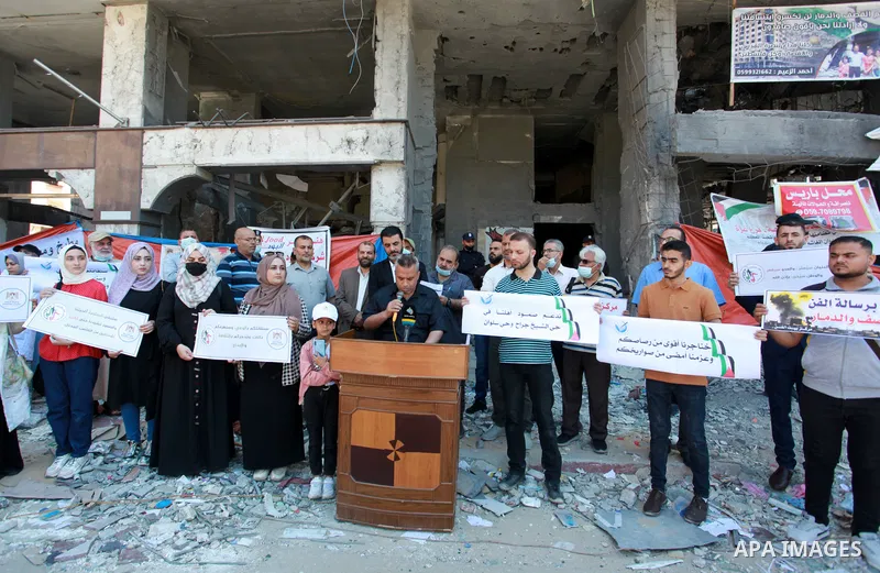 The Palestinian Artists Association take part in a protest against the destroyed of their headquarters by Israeli air strikes in front of al-Jawhara Tower destroyed, in Gaza City on June 6, 2021. Gaza’s housing ministry...
