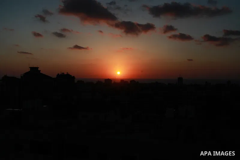 Sunset is seen over Gaza City on June 5, 2021. Palestinians mark "Naksa Day" to mourn the 54h anniversary of Israel's occupation of the West Bank and Gaza Strip in the Six-Day War. Photo by Naaman Omar