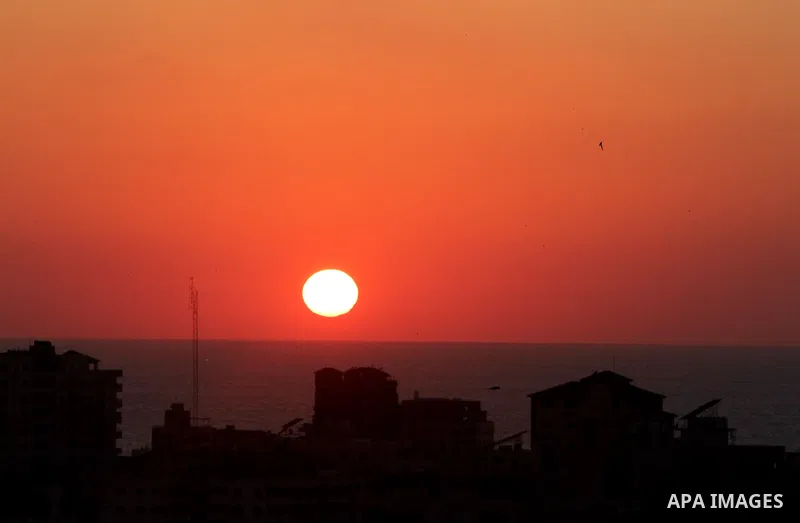 Sunset is seen over Gaza City on June 5, 2021. Palestinians mark "Naksa Day" to mourn the 54h anniversary of Israel's occupation of the West Bank and Gaza Strip in the Six-Day War. Photo by Naaman Omar