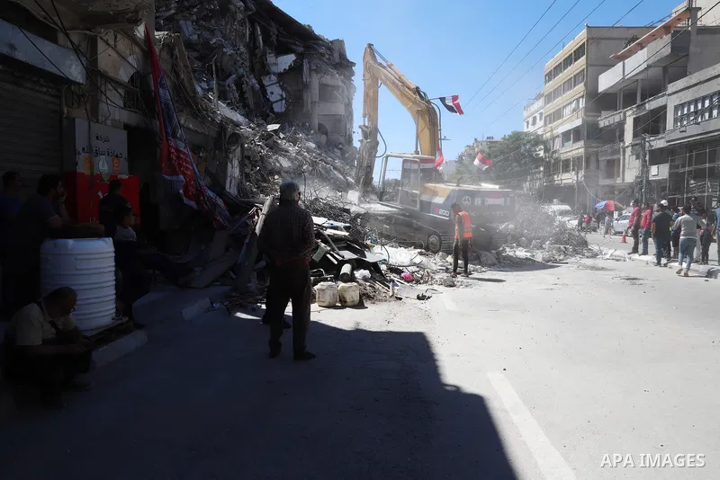 Egyptian bulldozers remove rubble from a building destroyed during the May 2021 conflict between Hamas and Israel, in Gaza City on June 5, 2021. Egypt sent an aid convoy to neighbouring Gaza with diggers, trucks and cran...