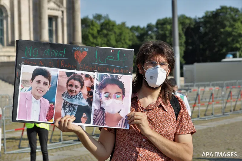Foreign activists take part during a protest against the killed of Palestinian children at Gaza city by Israeli airstrikes, in front of German Bundestag, in Berlin, Germany, on June 4, 2021. Photo by Manar Shahin