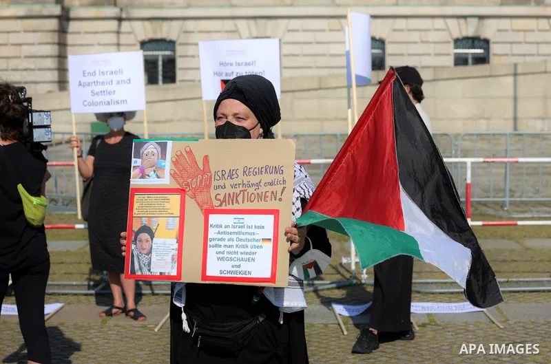Foreign activists take part during a protest against the killed of Palestinian children at Gaza city by Israeli airstrikes, in front of German Bundestag, in Berlin, Germany, on June 4, 2021. Photo by Manar Shahin