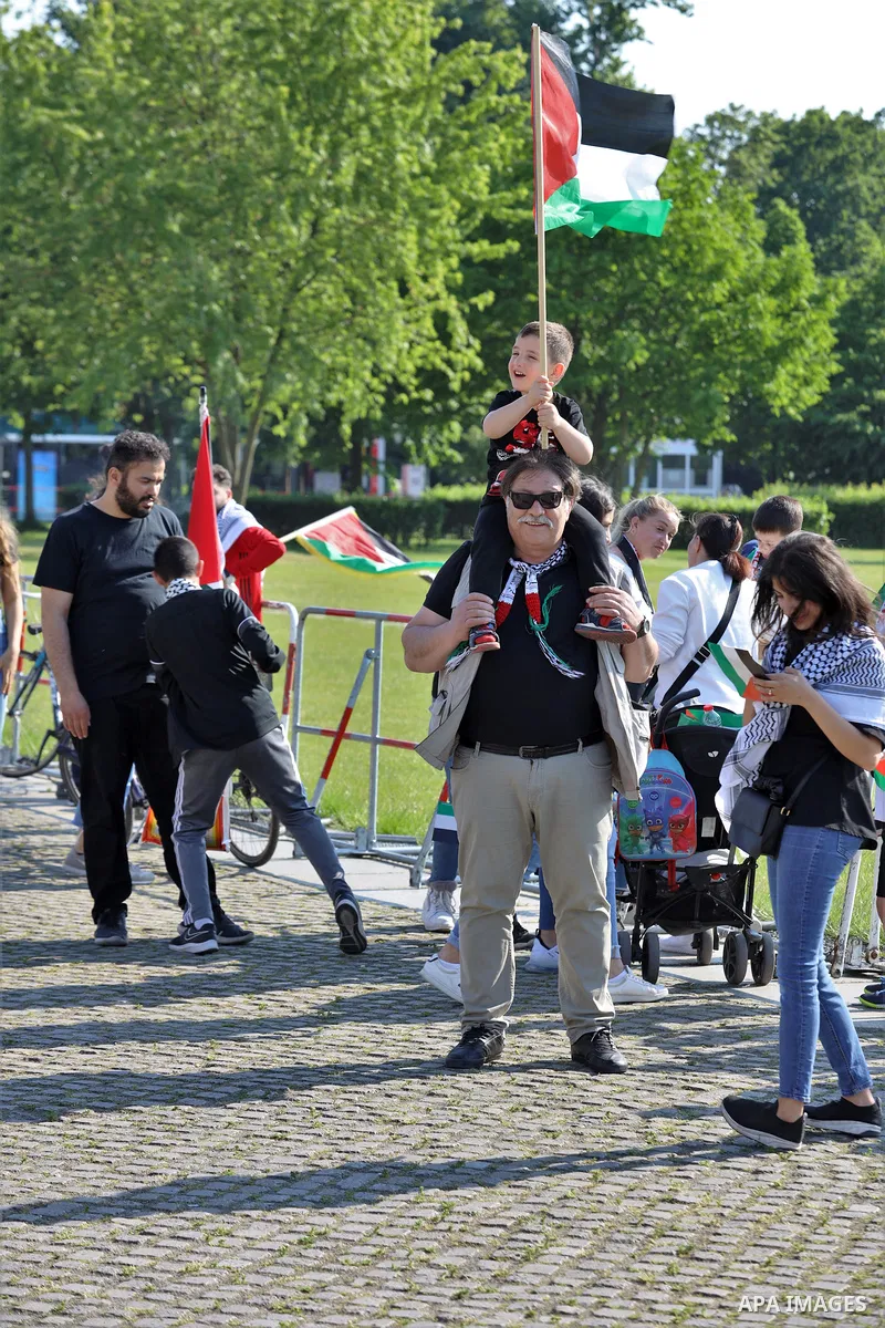 Foreign activists take part during a protest against the killed of Palestinian children at Gaza city by Israeli airstrikes, in front of German Bundestag, in Berlin, Germany, on June 4, 2021. Photo by Manar Shahin