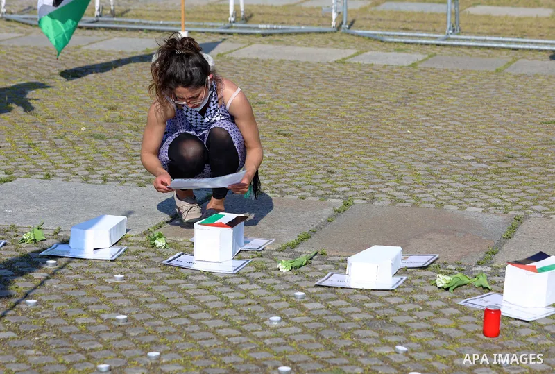 Foreign activists take part during a protest against the killed of Palestinian children at Gaza city by Israeli airstrikes, in front of German Bundestag, in Berlin, Germany, on June 4, 2021. Photo by Manar Shahin