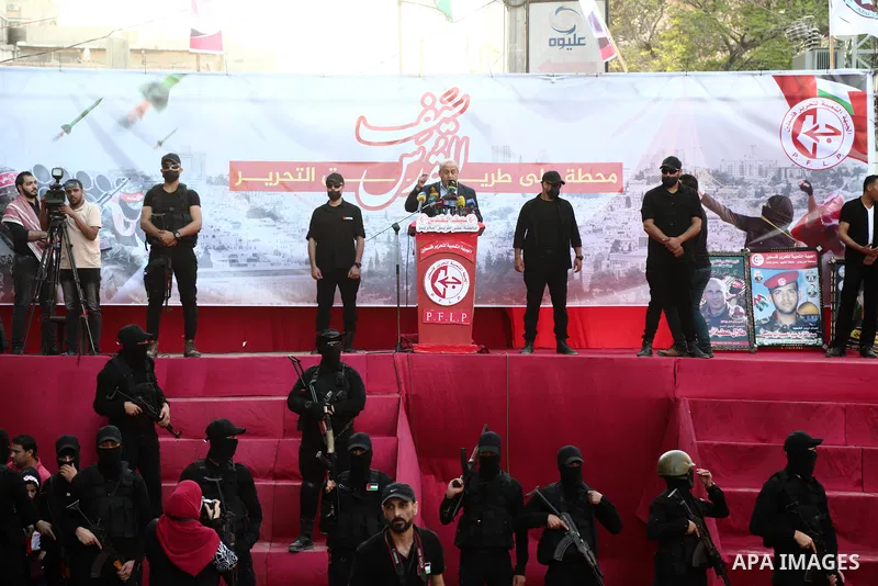 Supporters of Popular Front for the Liberation of Palestine (PFLP) attend an anti-Israel rally in Gaza city on June 2, 2021. The Egyptian-brokered truce ended 11 days of heavy Israeli bombing of Gaza and rocket fire from...