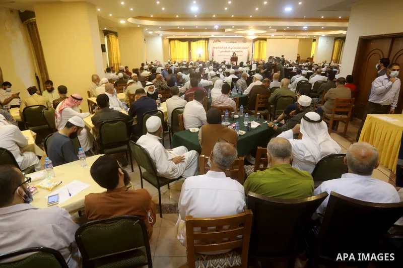Members of the Palestine Scholars Association, attend a conference in support of at the Al-Aqsa Mosque, in Gaza city, June 2, 2021. The escalation, which began after Israeli security forces banned Palestinians from acces...