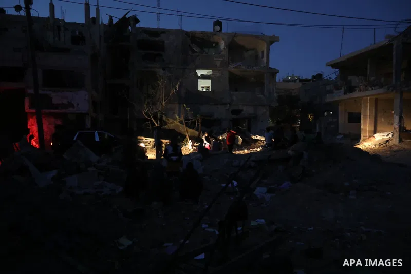Palestinians gather at the rubbles of their homes which was destroyed last month after Israeli airstrikes in Beit Hanoun, in the northern Gaza Strip, on June 01, 2021. Gaza’s housing ministry said on Thursday that 16,800...