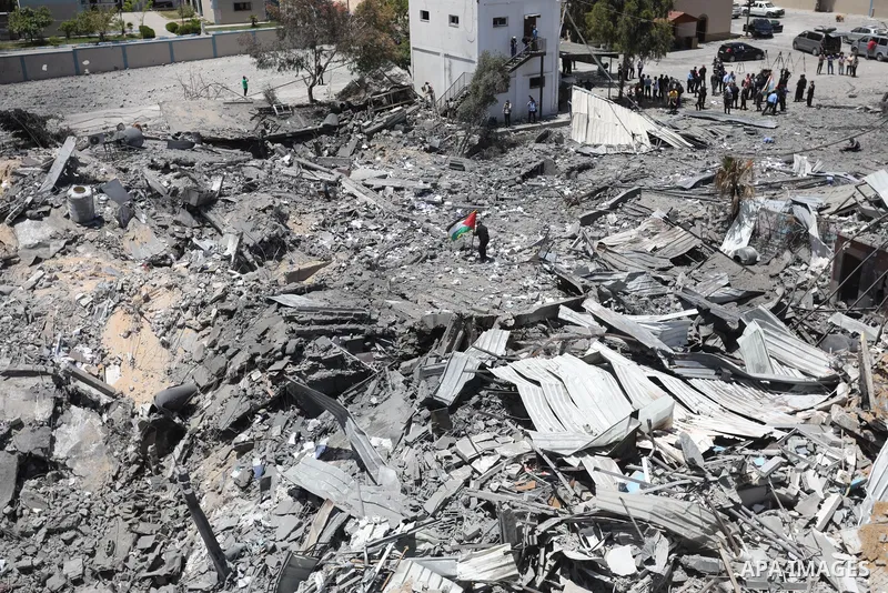 A Palestinian policeman walks on the rubble of Arafat City, Gaza's police headquarters on May 22, 2021, following a ceasefire between Israel and Hamas movment. UNICEF delivered today lifesaving critical humanitarian supp...