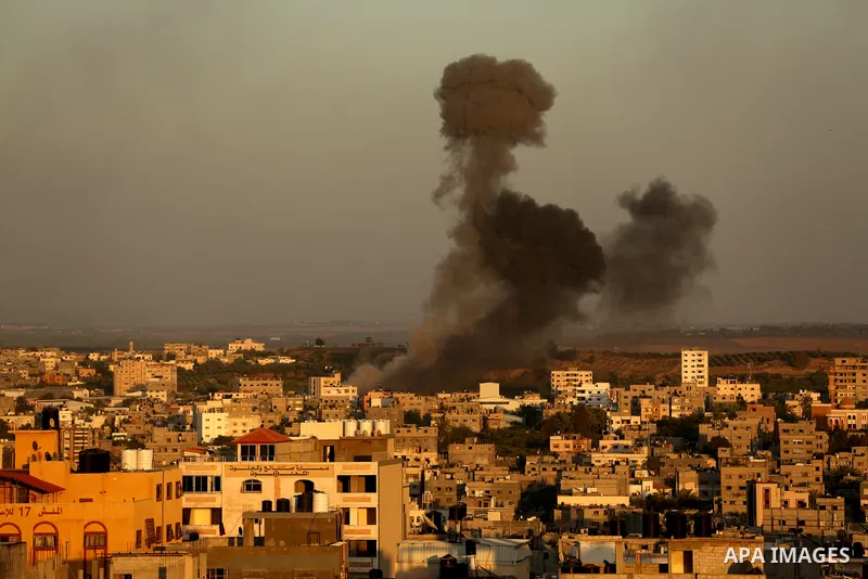 Smoke billows following an Israeli airstrike on Gaza City on May 19, 2021. Deafening air strikes and rocket fire once more shook Gaza overnight and early Wednesday amid an international diplomatic push to broker a ceasef...