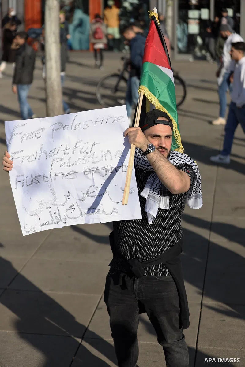 People attend a protest rally in solidarity with Palestinians in front of Alexanderplatz in Berlin, Germany, on May 19, 2021. According to the Palestinian Ministry of Health, at least 219 Palestinians, including 39 child...