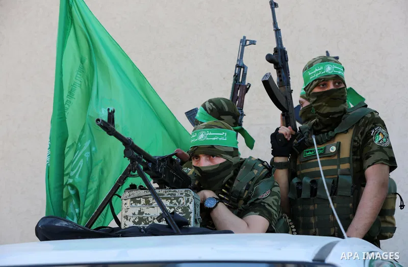 Members of Al-Qassam Brigades, the armed wing of the Hamas movement, attend a rally in Gaza City on May 24, 2021. A ceasefire was reached late last week after 11 days of deadly violence between Israel and the Hamas movem...