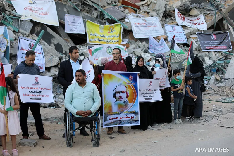 Palestinian Journalists take part in a protest on the Violation against Media Freedoms during the escalation on the Gaza Strip, in front of Jala' Tower which destroyed on May 15 during Israeli air-strike in Gaza city on...