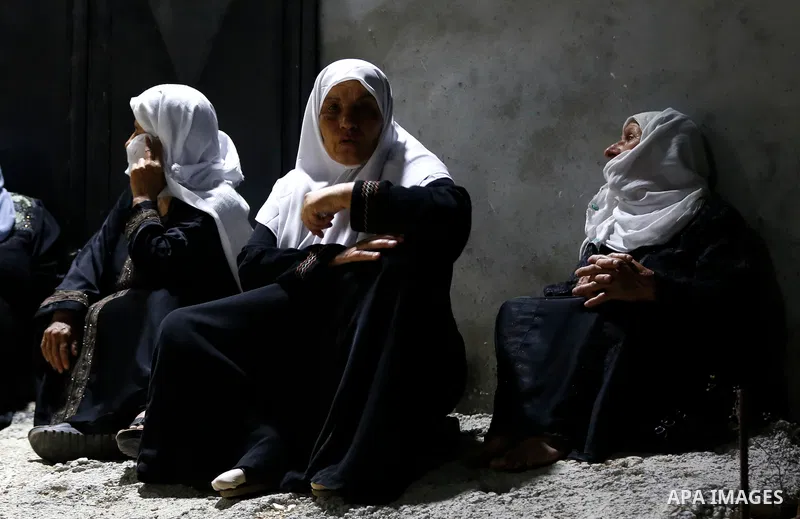 Relatives of 28-year-old Zakaria Hamayel, who was struck by a bullet to the chest by Israeli forces during a protest against settlement expansion, attend his funeral in the village of Baita, south of Nablus, in the occup...