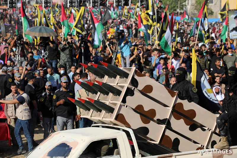 Fighters of al-Quds Brigades, the armed wing of the Palestinian Islamic Jihad movement, parade with their weapons in the streets of Gaza City during a rally, on May 29, 2021, more than a week after a ceasefire brought an...