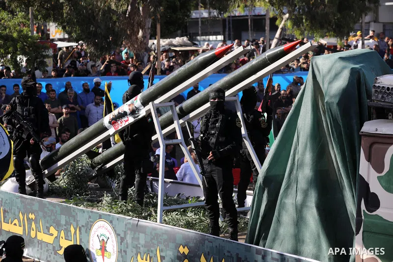 Fighters of al-Quds Brigades, the armed wing of the Palestinian Islamic Jihad movement, parade with their weapons in the streets of Gaza City during a rally, on May 29, 2021, more than a week after a ceasefire brought an...