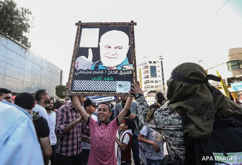 Supporters of al-Quds Brigades, the armed wing of the Palestinian Islamic Jihad movement, gather to watch them parade in the streets of Gaza City on May 29, 2021, more than a week after a ceasefire brought an end to 11 d...