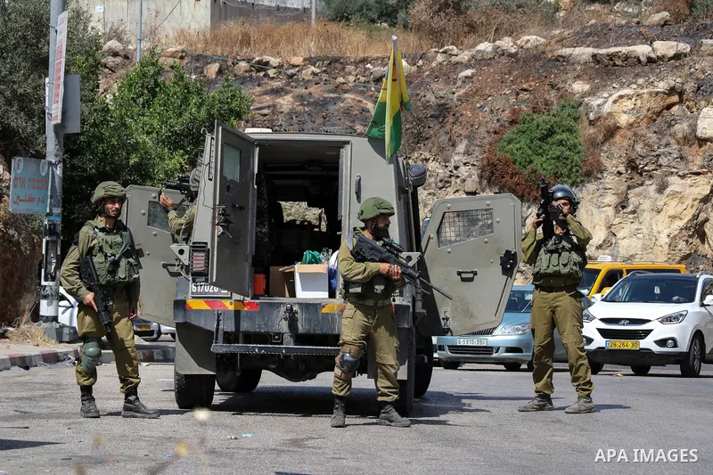 Members of Israeli border guard stand by a closed checkpoint entrance leading to the Palestinian village of Nilin west of Ramallah in the occupied West Bank, on May 29, 2021 amidst a protest against Israeli settlers' sei...