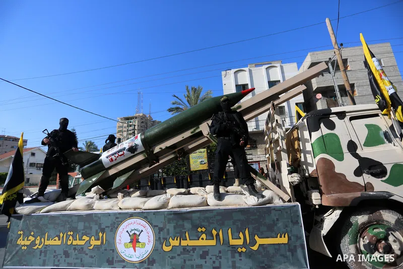 Fighters of al-Quds Brigades, the armed wing of the Palestinian Islamic Jihad movement, parade with their weapons in the streets of Gaza City during a rally, on May 29, 2021, more than a week after a ceasefire brought an...