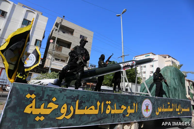 Fighters of al-Quds Brigades, the armed wing of the Palestinian Islamic Jihad movement, parade with their weapons in the streets of Gaza City during a rally, on May 29, 2021, more than a week after a ceasefire brought an...