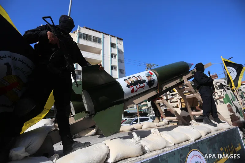 Fighters of al-Quds Brigades, the armed wing of the Palestinian Islamic Jihad movement, parade with their weapons in the streets of Gaza City during a rally, on May 29, 2021, more than a week after a ceasefire brought an...