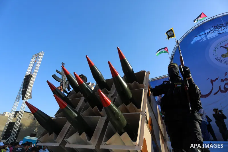 Fighters of al-Quds Brigades, the armed wing of the Palestinian Islamic Jihad movement, parade with their weapons in the streets of Gaza City during a rally, on May 29, 2021, more than a week after a ceasefire brought an...