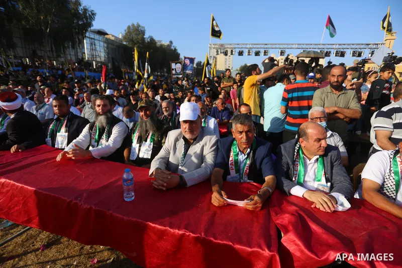 Supporters of al-Quds Brigades, the armed wing of the Palestinian Islamic Jihad movement, gather to watch them parade in the streets of Gaza City on May 29, 2021, more than a week after a ceasefire brought an end to 11 d...