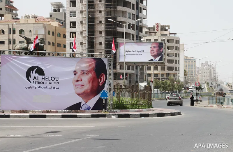 This picture taken on May 31, 2021 shows a view of a banner depicting Egypt's President Abdel Fattah al-Sisi amidst preparations to receive a visiting Egyptian intelligence delegation in Gaza City. Photo by Naaman Omar