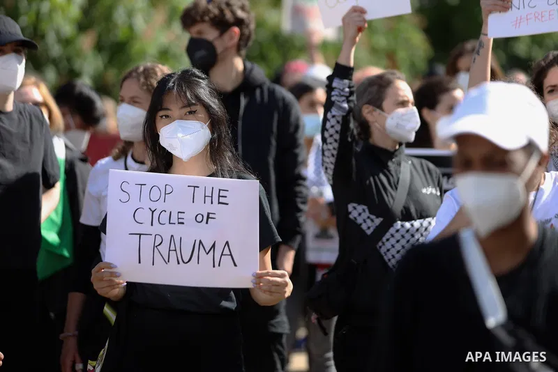 People attend a protest rally in solidarity with Palestinians in Berlin, Germany, Saturday, May 15, 2021. According to the Palestinian Ministry of Health, at least 140 Palestinians, including 39 children, were killed in...