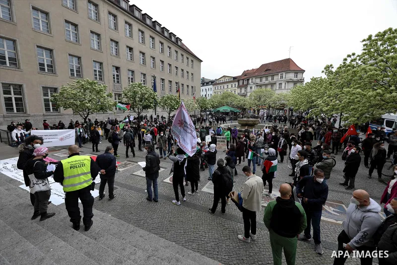 Palestinians and foreign activists take part in a protest in solidarity the Palestinians in Gaza strip and Jerusalem's Sheikh Jarrah neighbourhood, in Berlin, Germany, on May 12, 2021. Recent Israeli attacks on Gaza City...