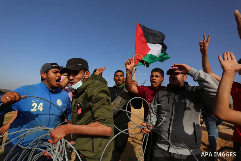 Palestinians demonstrate along the Israel-Gaza border, east of Khan Yunis town in the southern Gaza Strip on May 8, 2021. - Israel braced for more protests after clashes at Jerusalem's flashpoint Al-Aqsa Mosque compound...