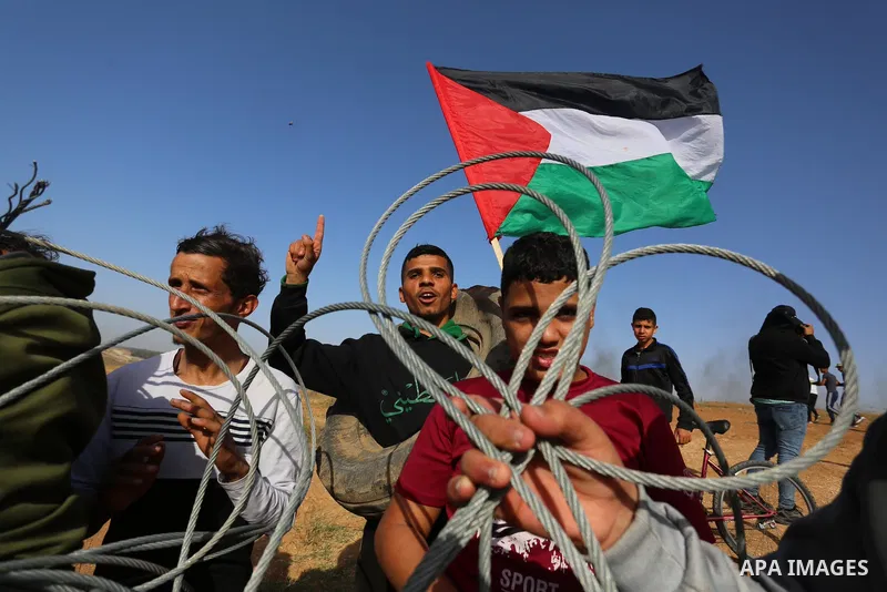 Palestinians demonstrate along the Israel-Gaza border, east of Khan Yunis town in the southern Gaza Strip on May 8, 2021. - Israel braced for more protests after clashes at Jerusalem's flashpoint Al-Aqsa Mosque compound...