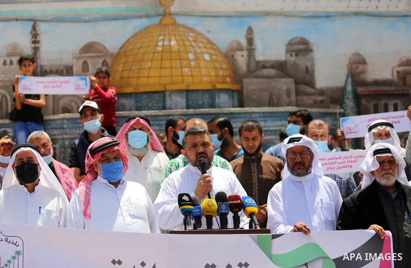Palestinians take part in a prtoest in solidarity with Sheikh Jarrah neighbourhood, in Deir Al-Balah in the center of Gaza Strip on May 08, 2021. More than 170 Palestinians have been injured after Israeli police stormed...