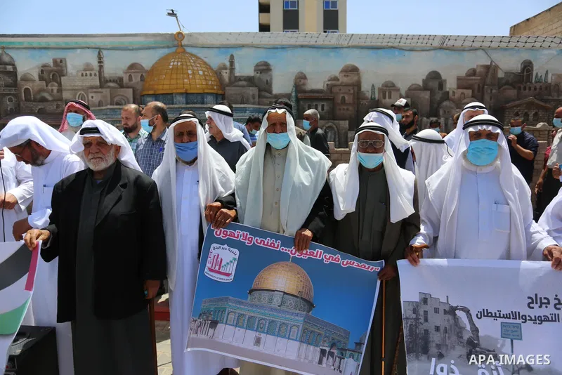 Palestinians take part in a prtoest in solidarity with Sheikh Jarrah neighbourhood, in Deir Al-Balah in the center of Gaza Strip on May 08, 2021. More than 170 Palestinians have been injured after Israeli police stormed...
