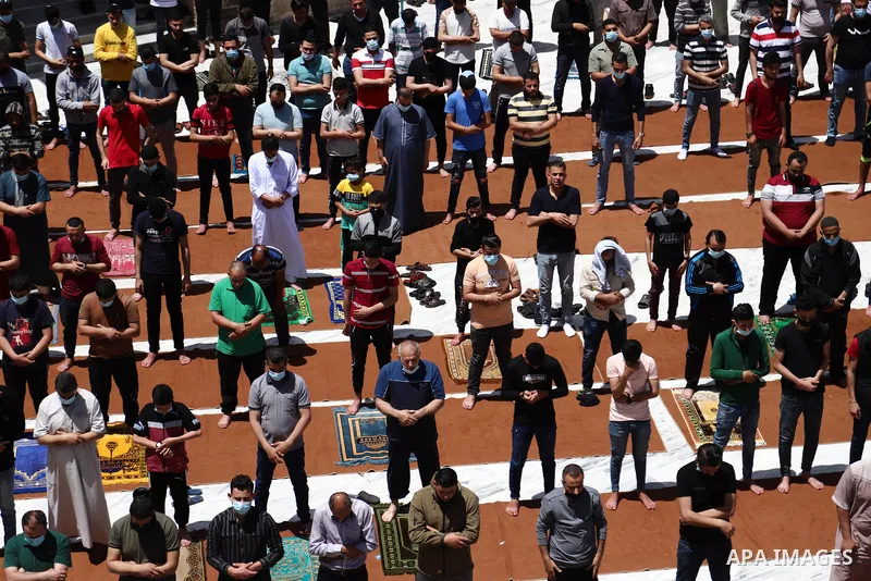 Palestinian Muslims pray on the last Friday of Ramadan at al-Omari mousque in Gaza city amid the COVID-19 pandemic on May 07, 2021. Photo by Mahmoud Ajjour
