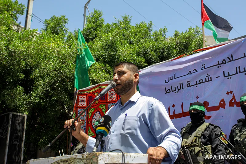 Palestinians and members of Ezz-Al Din Al-Qassam Brigades, the armed wing of the Hamas movemen take part in a prtoest in solidarity with Sheikh Jarrah neighbourhood, in Jabalia in the nothern of Gaza Strip on May 07, 202...