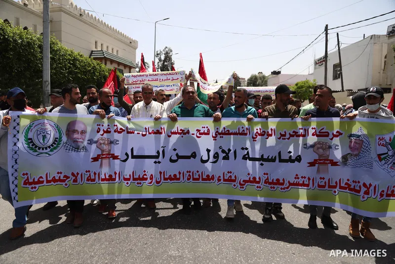 Supporters of Democratic Reformist Current, take part in a protest against postponement of the Palestinian parliamentary and presidential elections in front of the Ministry of Labor, in Gaza city, on May 5, 2021. Palesti...