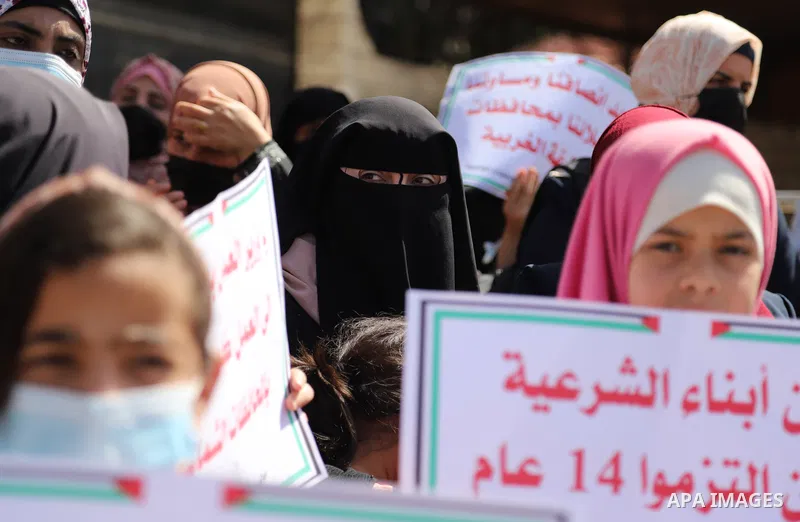 Palestinian employees of the security services -2005, take part in a protest to demand return to their works and their rights, marking International Workers' Day, in front of the Council of Ministers headquarters, in Gaz...
