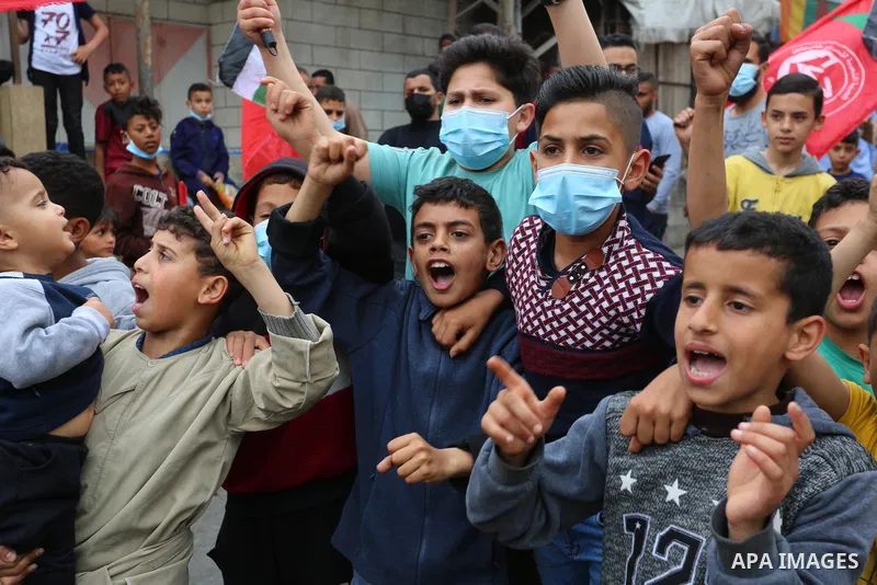 Palestinian supporters of the Fatah movement, take part in a protest in support of the Al-Aqsa Mosque in Deir Al-Balah, middle of Gaza Strip, on April 24, 2021. The Jerusalem uprising, as it has been dubbed (in Arabic in...