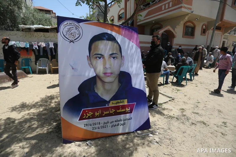 Relatives of the Palestinian Yousef Abu Jazar, mourn during his funeral, in Rafah in the southern of Gaza strip, on April 25, 2021. On Thursday, the Israeli occupation authorities delivered the body of the Palestinian ch...