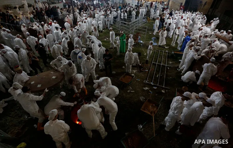 Members of the ancient Samaritan community participates in the ritual of Passover Sacrifice on Mount Gerizim, overlooking the West Bank town of Nablus, Thursday, April 25, 2021. Samaritans descended from the ancient Isra...
