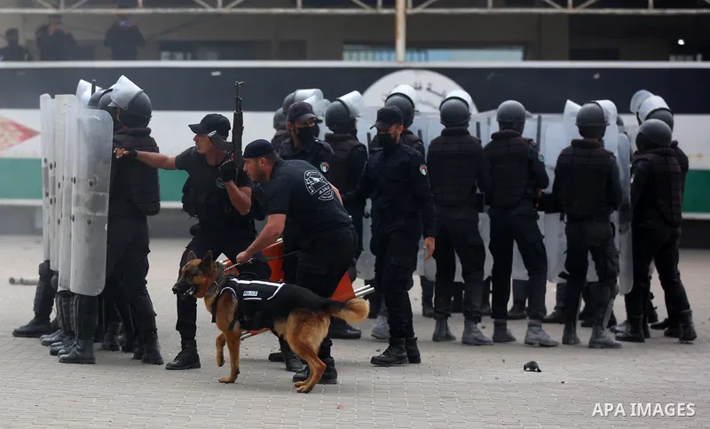 Palestinian policemen wearing protective face masks take part in a graduation ceremony, amid concerns about the spread of the coronavirus disease (COVID-19) at Ribat University College, in Gaza City on April 26, 2021. Th...