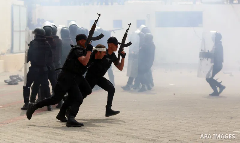 Palestinian policemen wearing protective face masks take part in a graduation ceremony, amid concerns about the spread of the coronavirus disease (COVID-19) at Ribat University College, in Gaza City on April 26, 2021. Th...