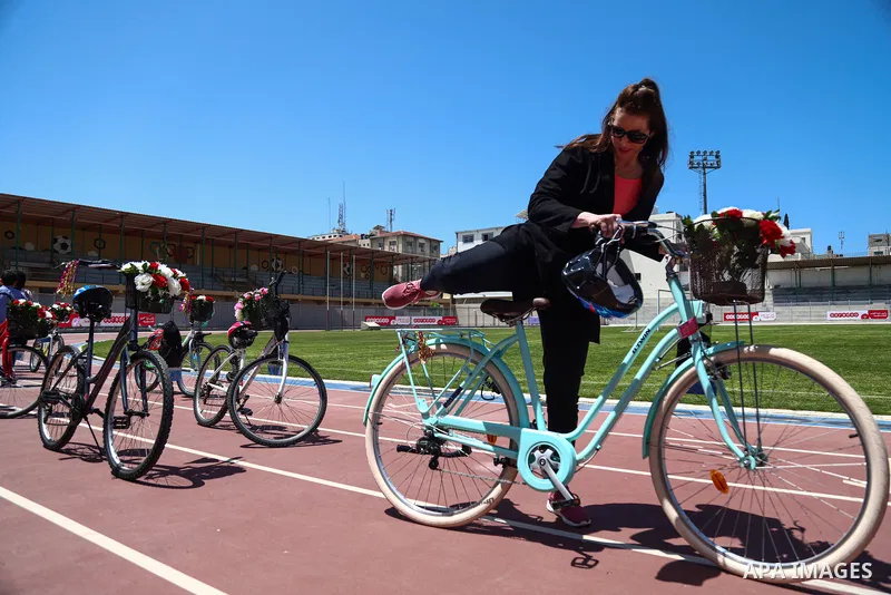 Palestinian women participate in cycling, "breathe deeply" at the Yarmouk stadium in Gaza City, on April 27, 2021. The "pink bike" project provides women and girls in the Gaza Strip the opportunity to ride bicycles in pr...
