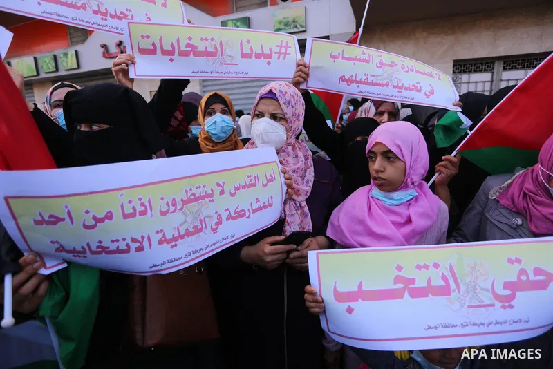 Supporters of Democratic Reformist Current take part in a protest against the possibility of cancelling the Palestinian elections in Deir al-Balah in the center of Gaza Strip on April 29, 2021. Photo by Ashraf Amra