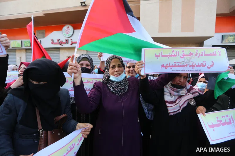 Supporters of Democratic Reformist Current take part in a protest against the possibility of cancelling the Palestinian elections in Deir al-Balah in the center of Gaza Strip on April 29, 2021. Photo by Ashraf Amra