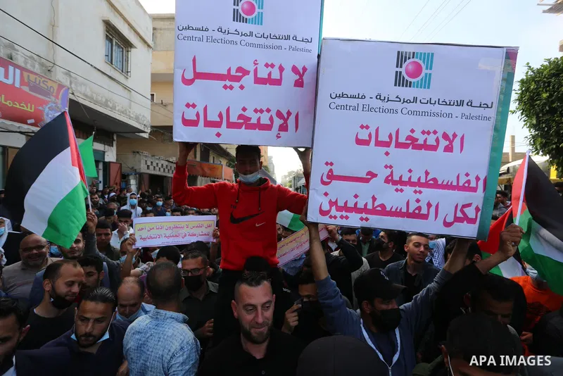 Supporters of Democratic Reformist Current take part in a protest against the possibility of cancelling the Palestinian elections in Deir al-Balah in the center of Gaza Strip on April 29, 2021. Photo by Ashraf Amra