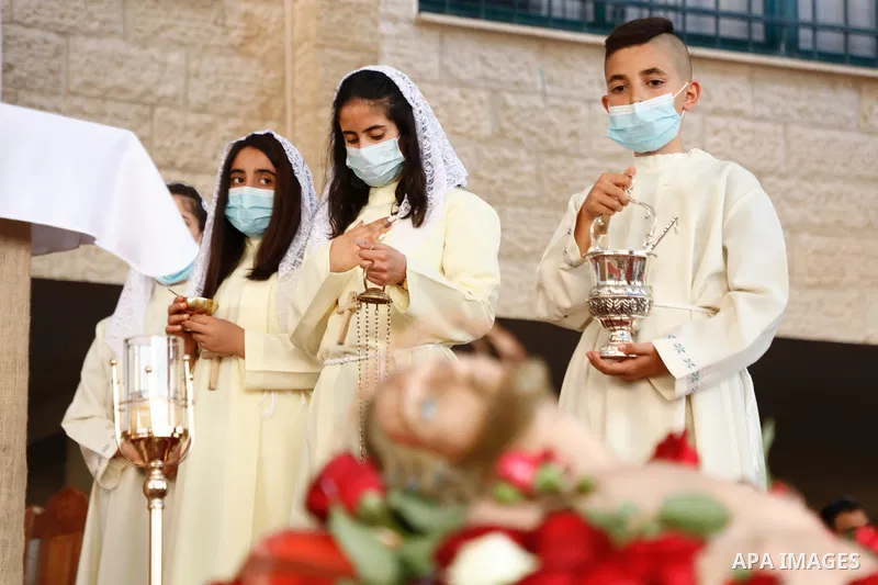 Palestinian Christians attend the "Good Friday" celebrations in the West Bank city of Jenin on April 30, 2021. Christian denominations around the world celebrate "Good Friday" as the remembrance of the day on which the P...