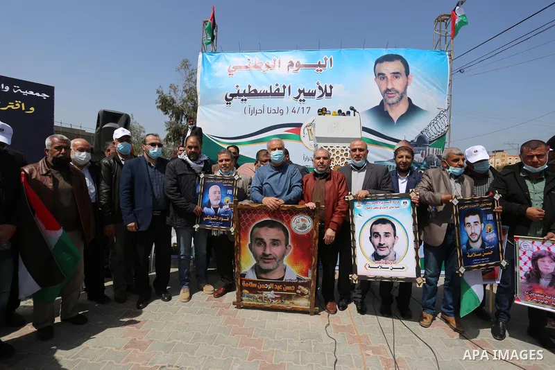 Palestinians take part in the press conference to announce the activities of the National Day of the Palestinian Prisoners' Day entitled (born free), in front of the house of the Palestinian Prisoner, Leader Hassan Salam...